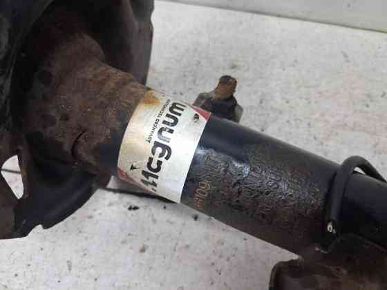Амортизатор передний левый Nissan Note 2005-2013 543039U025 (Арт. 84519) Киев