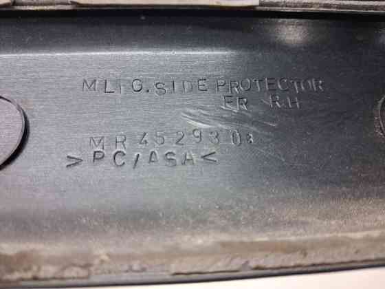 Накладка двери Mitsubishi Pajero Sport K9 2.5 DIESEL 4D56 1996 перед. прав. (б/у) Киев